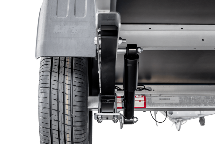 Remorcă auto pe arcuri 230x125 UNITRAILER GARDEN 230/R KIPP cu laterale din plasă, cadru H-800 și prelată gri
